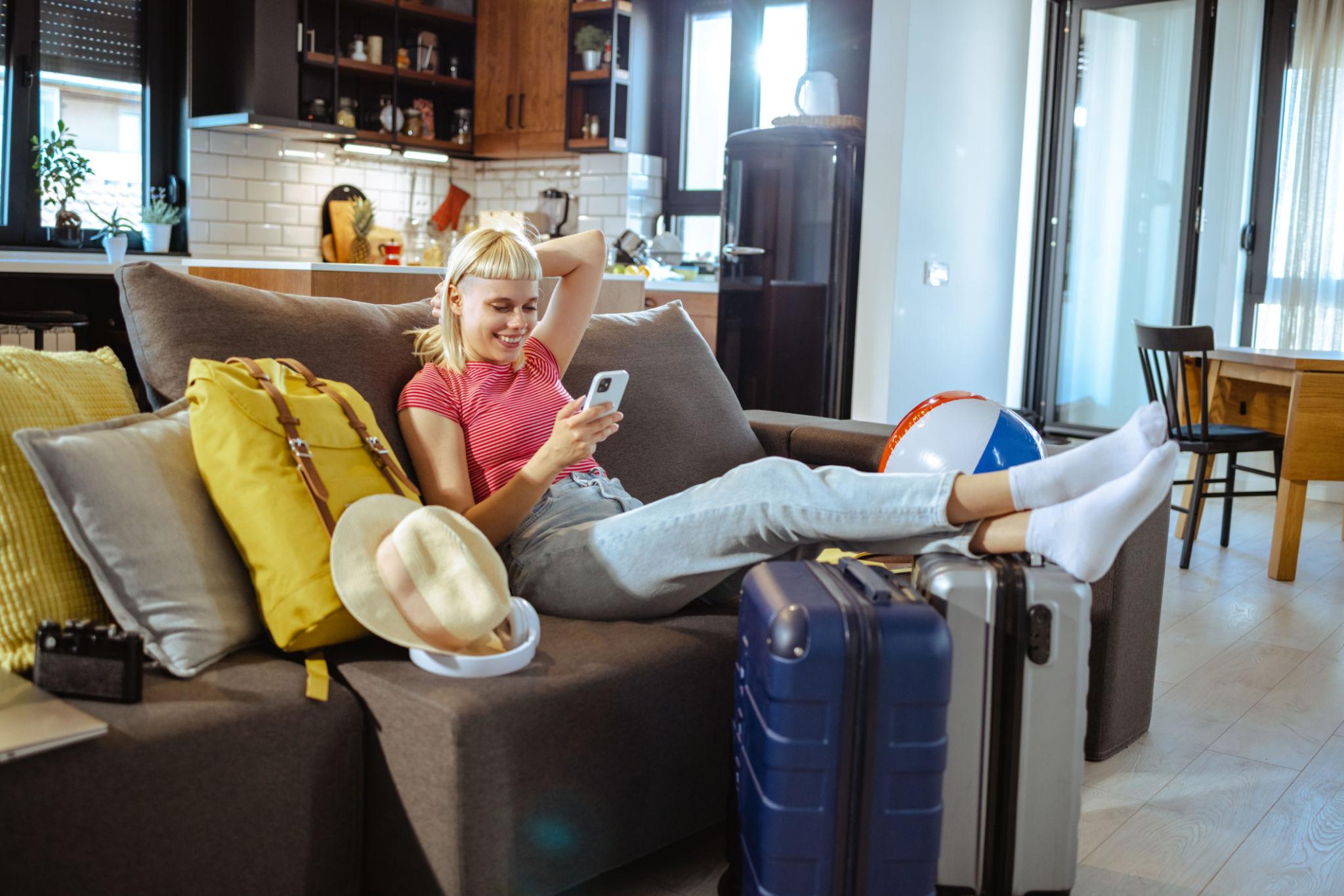 A guest relaxing in their apartment, using the guest companion